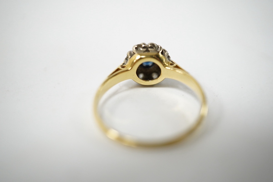 A small 18ct gold, sapphire and diamond set circular cluster ring, size J, gross weight 2.3 grams. Condition fair to good